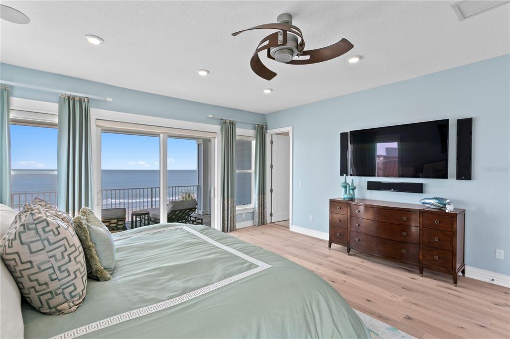 15612 Gulf Boulevard Redington Beach, FL 33708 - Photo 34 of 92 a bedroom with a bed and a flat screen tv on dresser