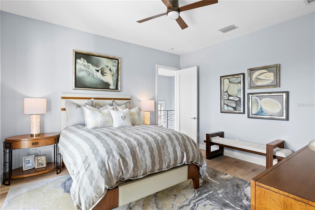 15612 Gulf Boulevard Redington Beach, FL 33708 - Photo 48 of 92 a bedroom with a bed and a desk