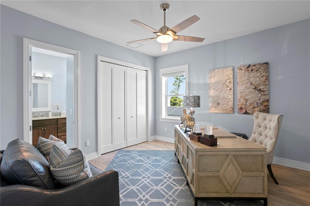 15612 Gulf Boulevard Redington Beach, FL 33708 - Photo 51 of 92 a living room with furniture and a chandelier