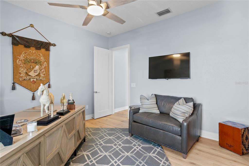 15612 Gulf Boulevard Redington Beach, FL 33708 - Photo 52 of 92 a living room with furniture and a flat screen tv