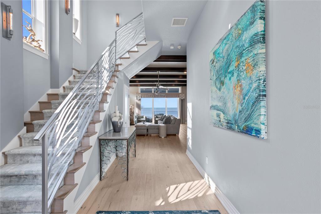 15612 Gulf Boulevard Redington Beach, FL 33708 - Photo 6 of 92 a view of entryway and hall with wooden floor