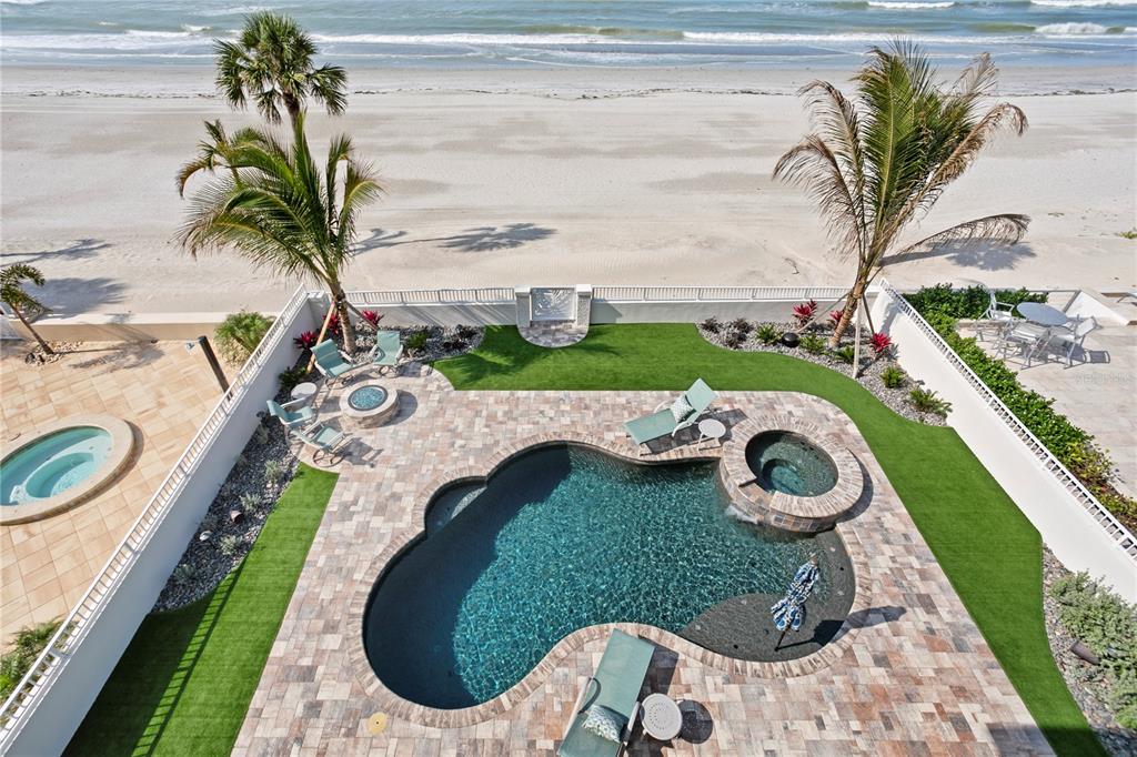 15612 Gulf Boulevard Redington Beach, FL 33708 - Photo 66 of 92 a view of a swimming pool with a yard and plants