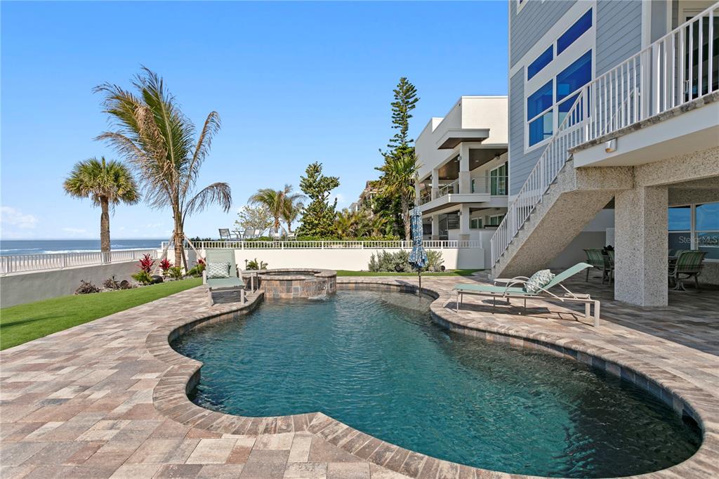 15612 Gulf Boulevard Redington Beach, FL 33708 - Photo 70 of 92 a swimming pool with outdoor seating and yard