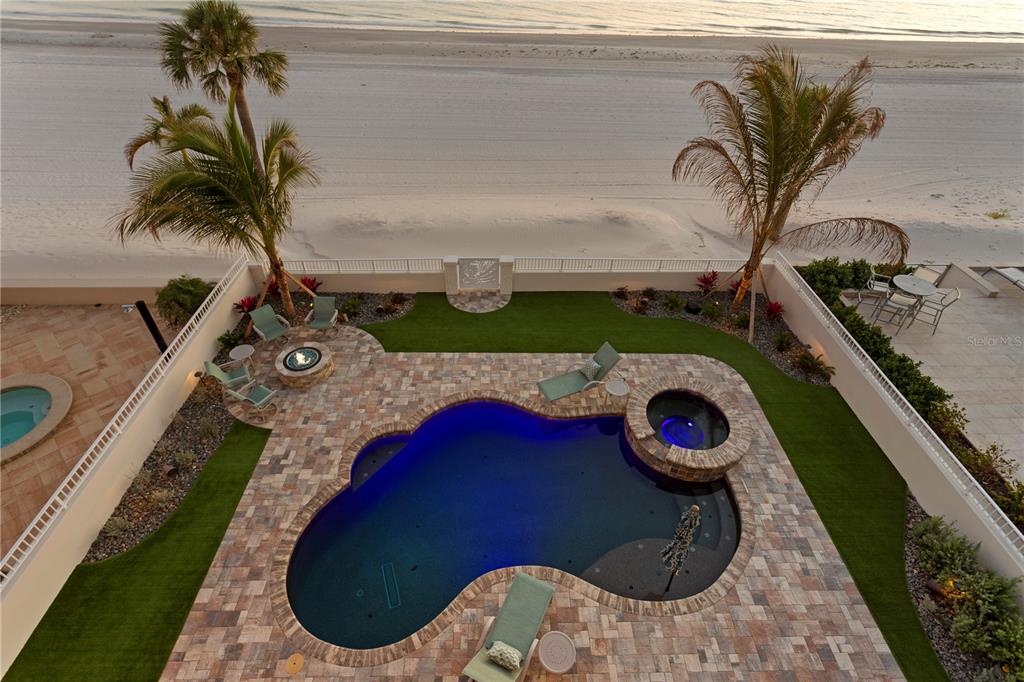 15612 Gulf Boulevard Redington Beach, FL 33708 - Photo 73 of 92 a view of a swimming pool with a sitting chair