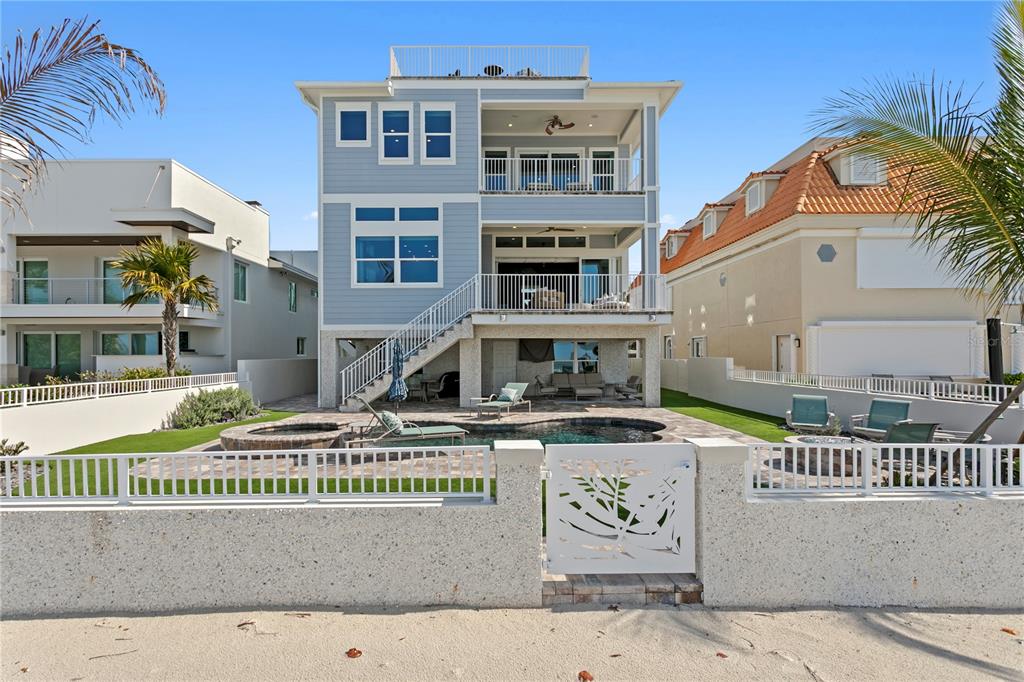15612 Gulf Boulevard Redington Beach, FL 33708 - Photo 89 of 92 a front view of a building with glass windows