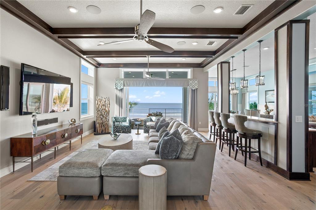 15612 Gulf Boulevard Redington Beach, FL 33708 - Photo 9 of 92 a living room with furniture and a chandelier