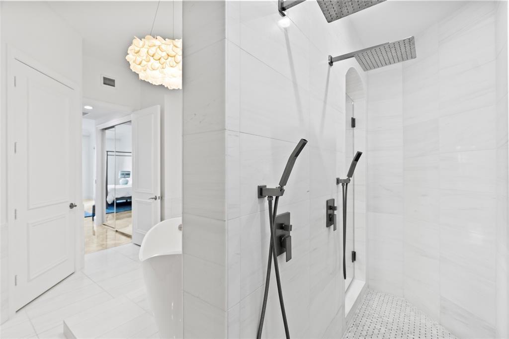 701 Southeast 21st Avenue, Unit 109 Deerfield Beach, FL 33441 - Photo 13 of 34 a bathroom with a shower