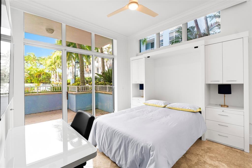 701 Southeast 21st Avenue, Unit 109 Deerfield Beach, FL 33441 - Photo 17 of 34 a bedroom with a bed and a window