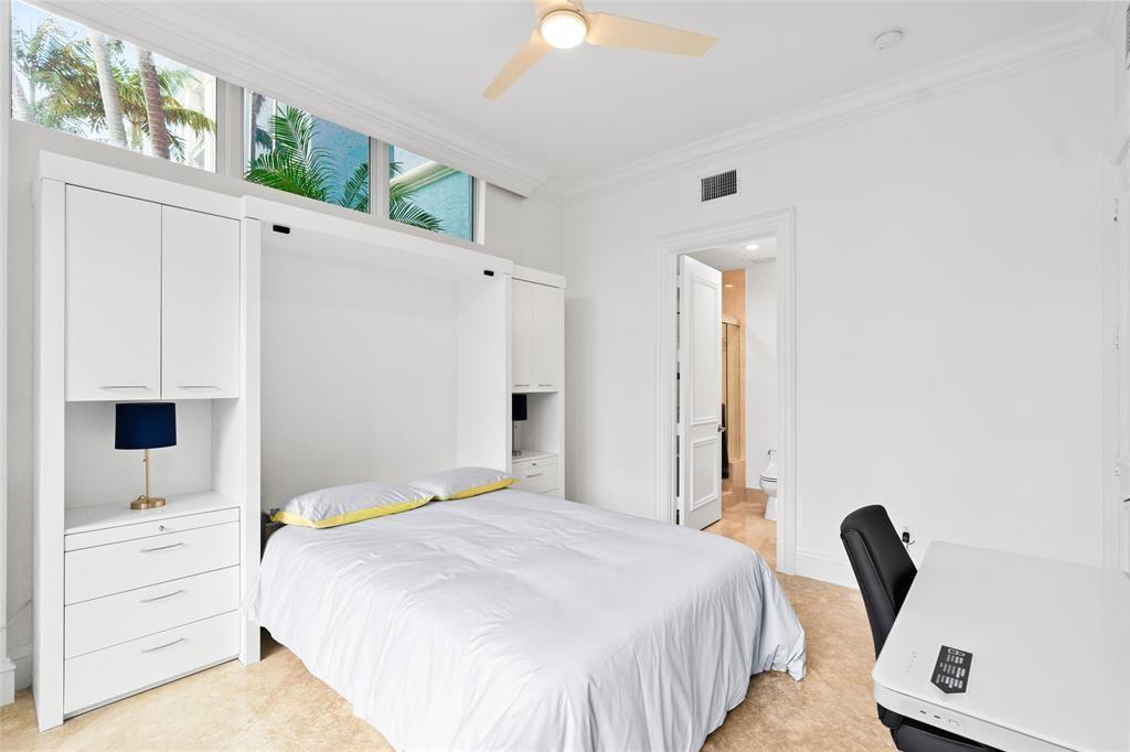 701 Southeast 21st Avenue, Unit 109 Deerfield Beach, FL 33441 - Photo 18 of 34 a bedroom with a bed and a window