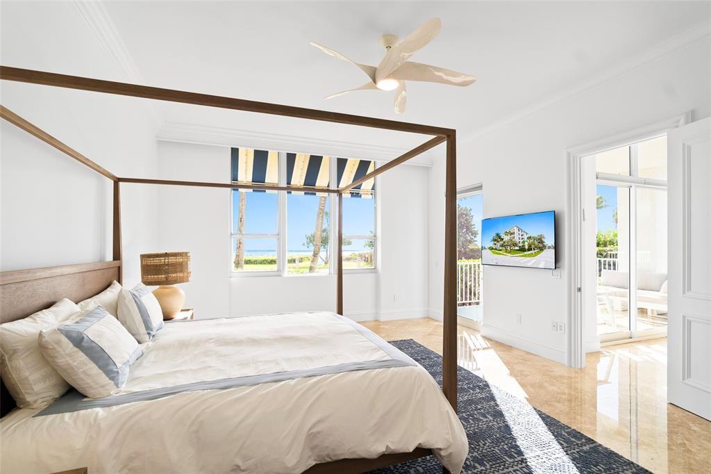 701 Southeast 21st Avenue, Unit 109 Deerfield Beach, FL 33441 - Photo 10 of 34 a bedroom with a large bed and a window