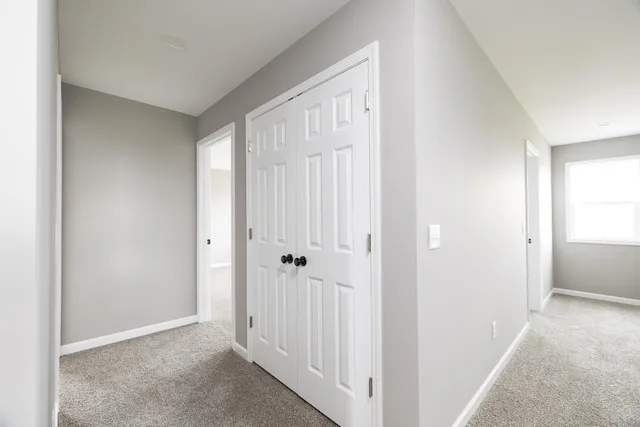 a white toilet sitting next to a bath tub