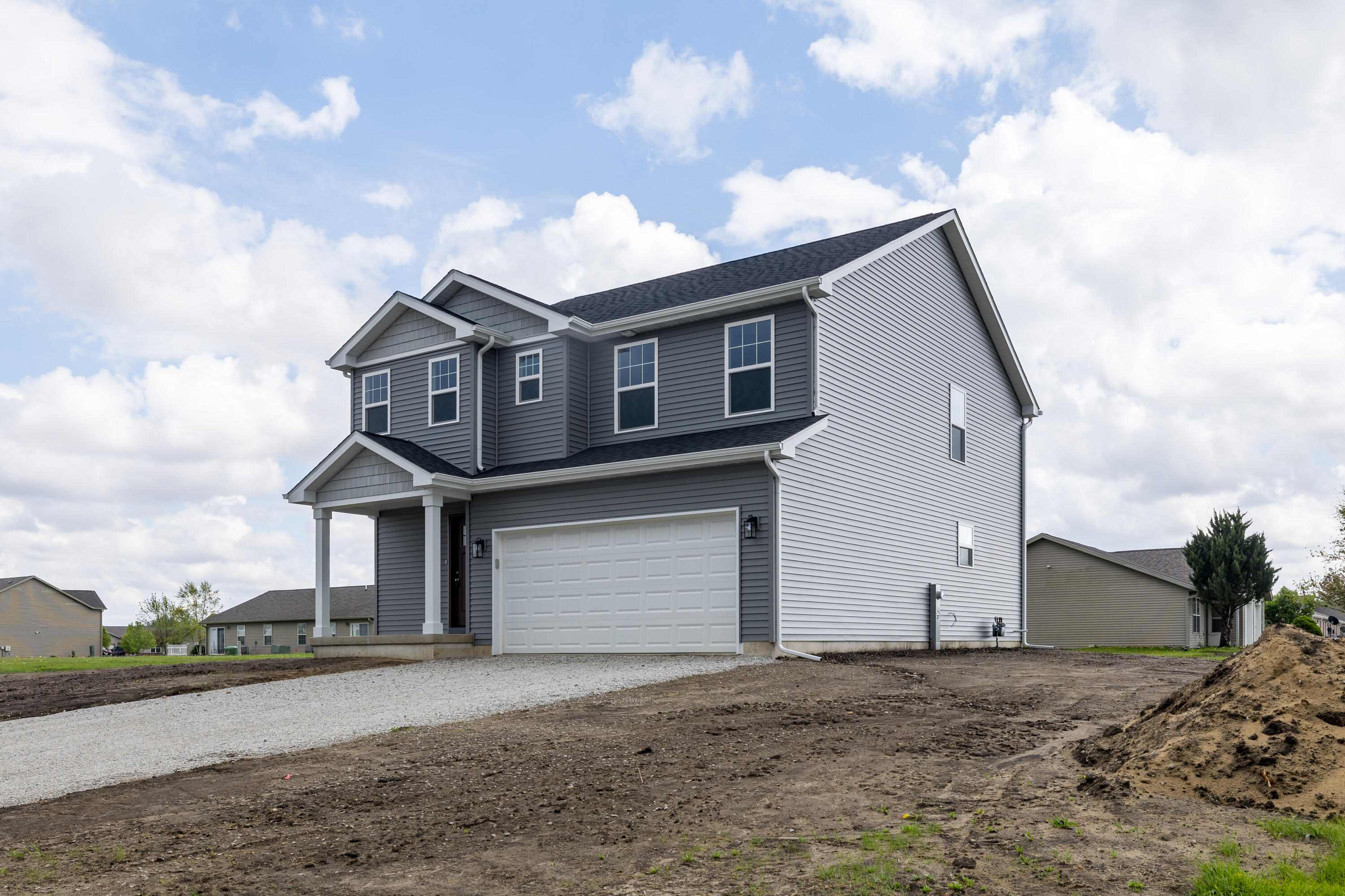 403 Wolf Street Rensselaer, IN 47978 - Photo 7 of 38 a front view of a house with a yard and garage