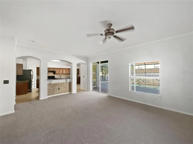 a view of a big room with windows and cabinet