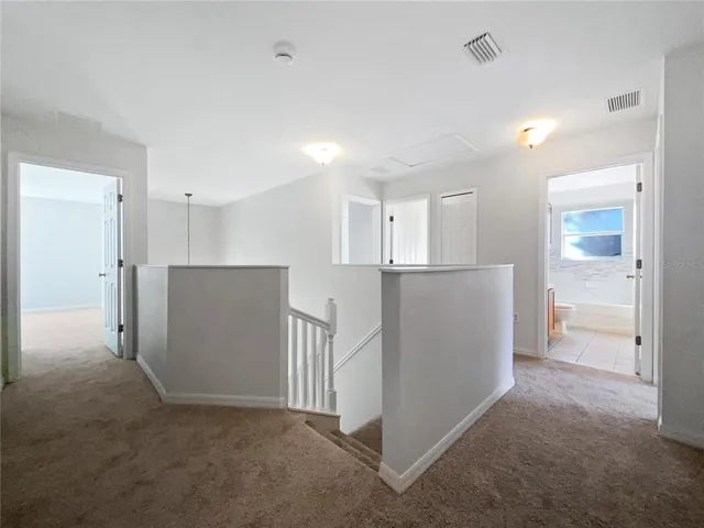 a view of a kitchen with a refrigerator and a stove