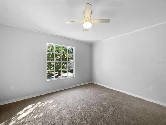 an empty room with windows and yard