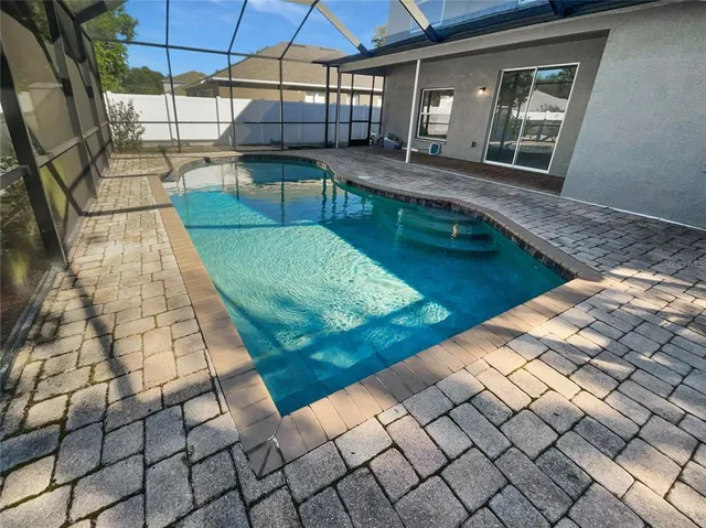 a view of a backyard with sitting area