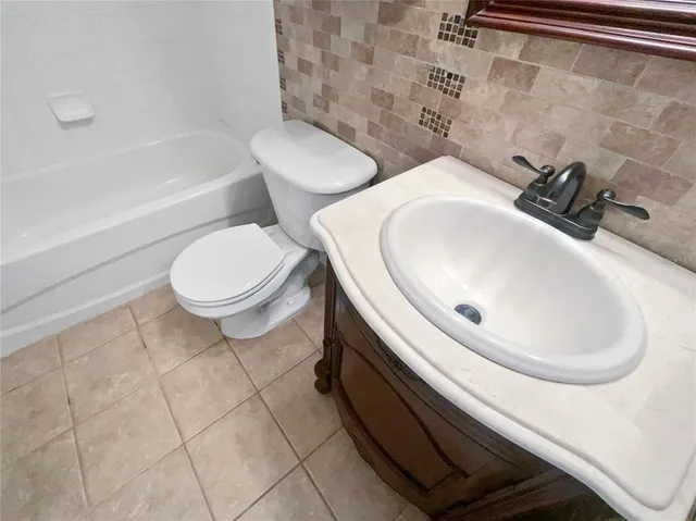 a bathroom with a sink and toilet