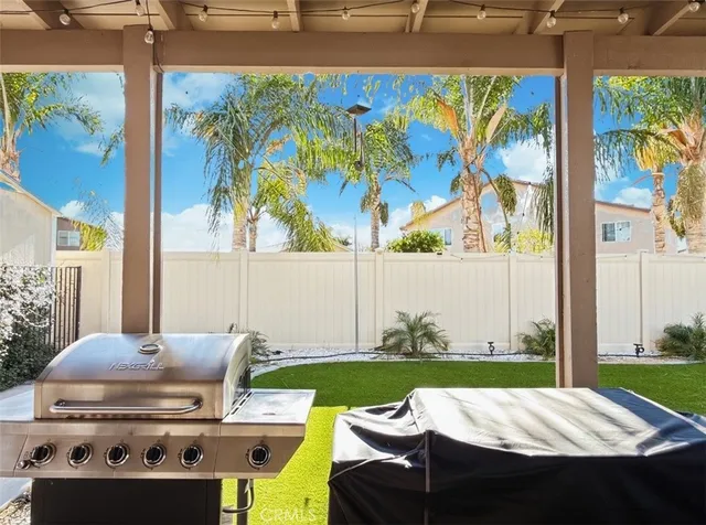 a view of a swimming pool with a patio and a garden