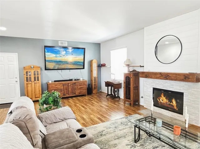 a living room with furniture and a fireplace