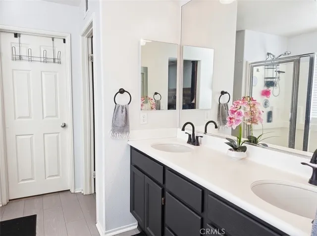a bathroom with cabinets a sink and a mirror