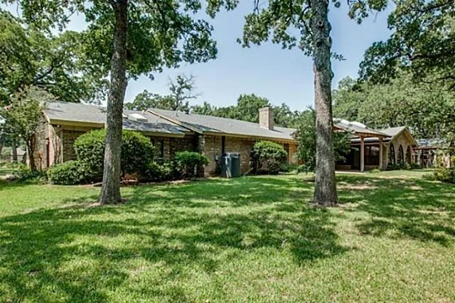 a backyard of a house with lots of green space