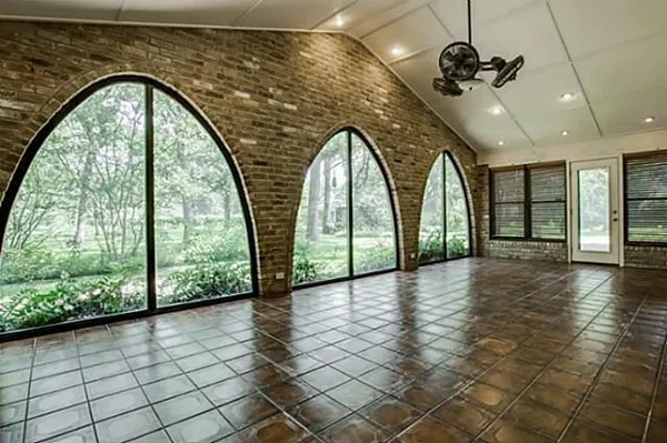 a view of empty room with floor to ceiling windows and outdoor view