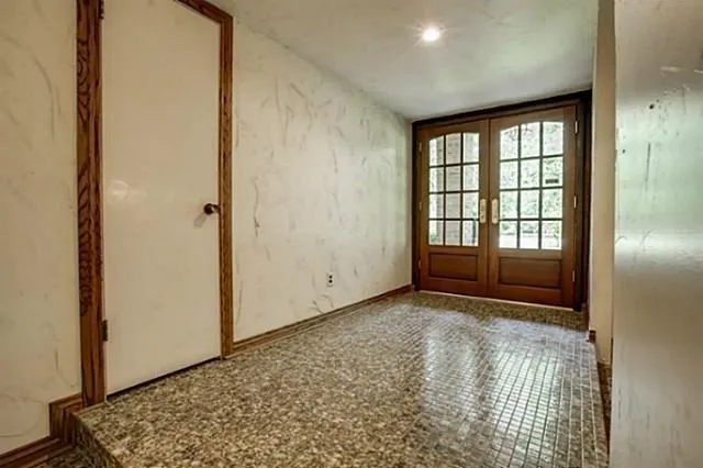 a view of an empty room with a fireplace