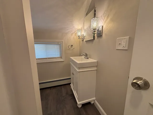 a room with a mirror and a sink