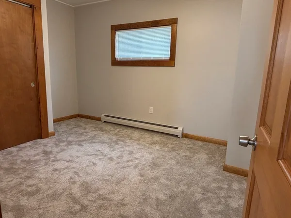 an empty room with a bathroom