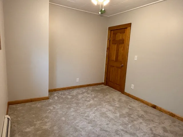 a white toilet sitting next to a bath tub