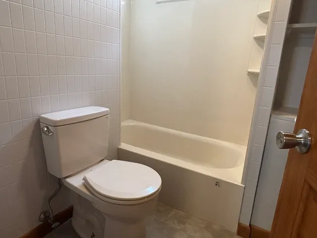 a bathroom with a sink a mirror and a bathtub