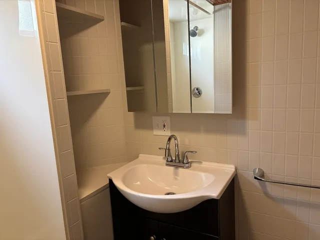 a view of an empty room and a window