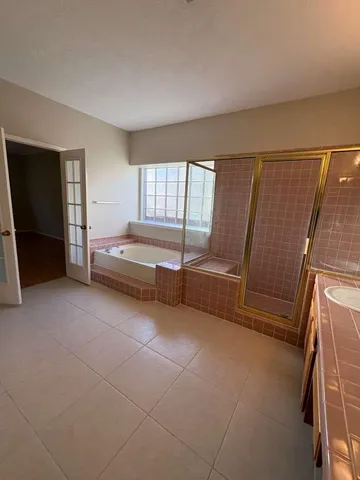 a view of an empty room with a fireplace