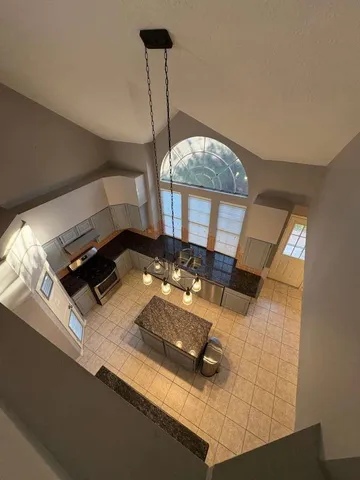 a living room with a bed furniture and a table