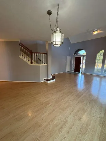 a view of a livingroom with wooden floor