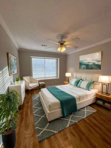 a bedroom with a bed and a chandelier