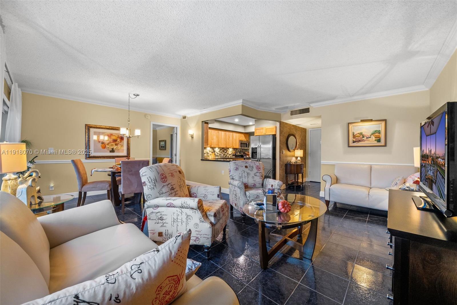 200 Diplomat Parkway, Unit 732 Hallandale Beach, FL 33009 - Photo 11 of 35 a living room with furniture and wooden floor