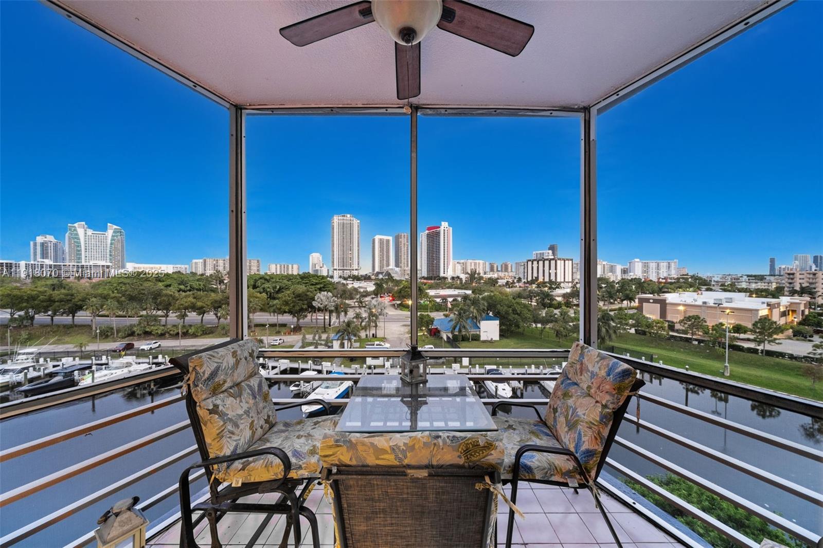200 Diplomat Parkway, Unit 732 Hallandale Beach, FL 33009 - Photo 24 of 35 a view of a balcony with chairs