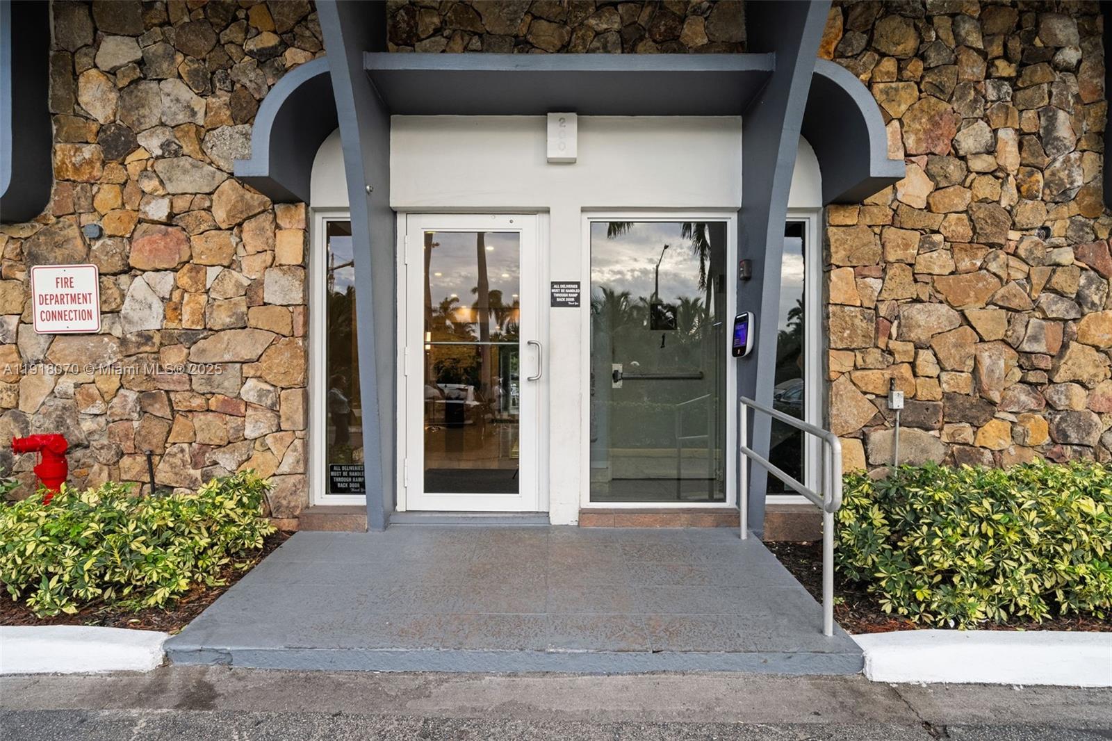 200 Diplomat Parkway, Unit 732 Hallandale Beach, FL 33009 - Photo 28 of 35 a view of entrance gate of the house and potted plants