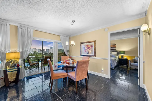 a kitchen with stainless steel appliances granite countertop a sink and a refrigerator