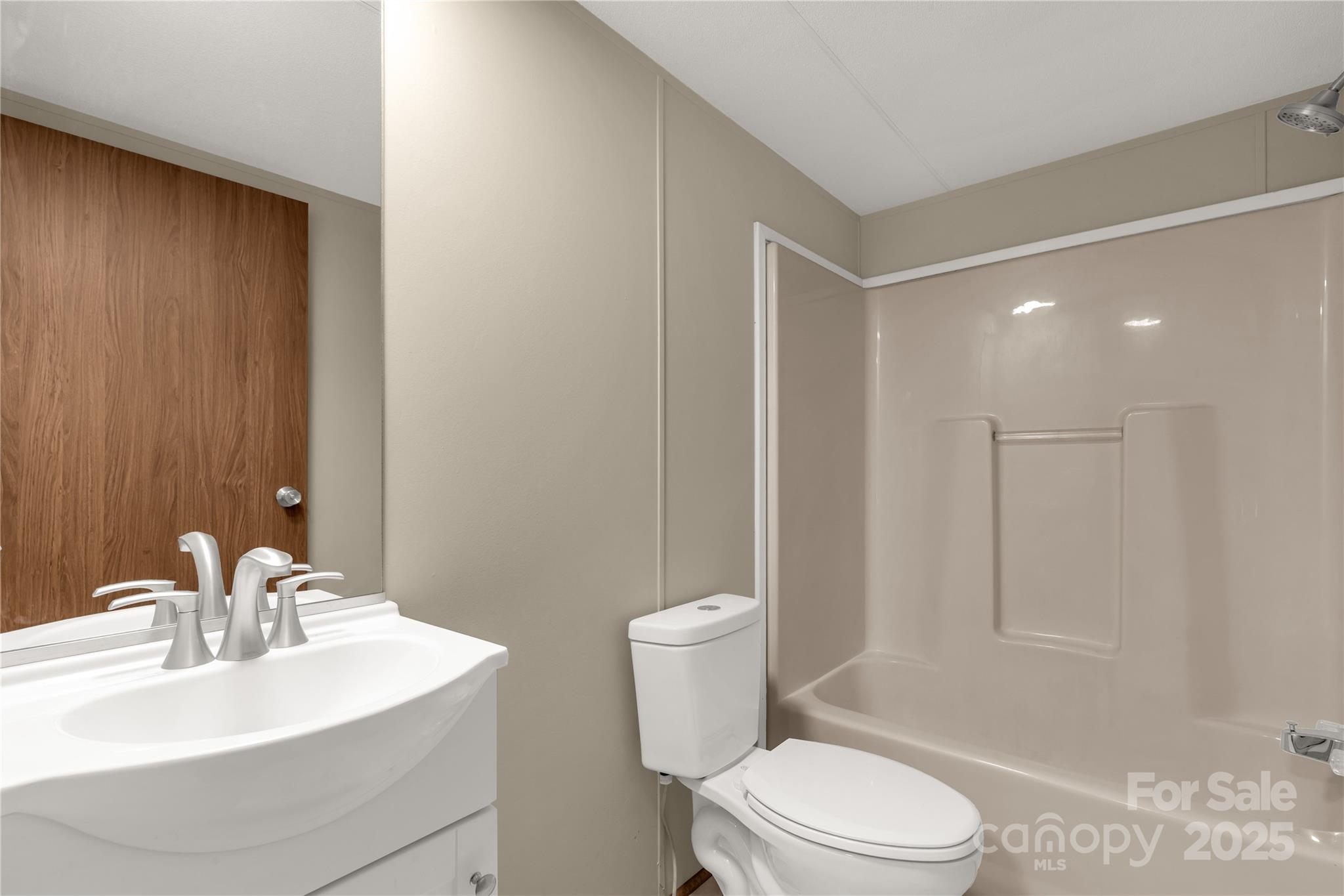 288 John L Hudson Sr Road Lancaster, SC 29720 - Photo 31 of 44 a bathroom with a sink a toilet a mirror and shower