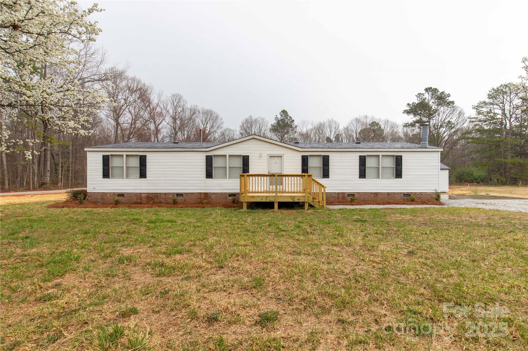 288 John L Hudson Sr Road Lancaster, SC 29720 - Photo 35 of 44 a house with trees in the background