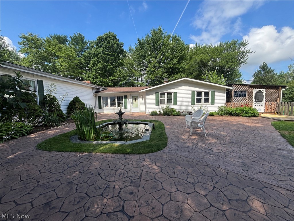 385 Cochran Road Aurora, OH 44202 - Photo 27 of 35 Patio with fountain and pond.