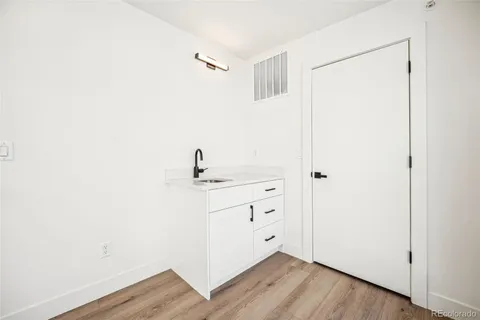 a view of a room with wooden floor