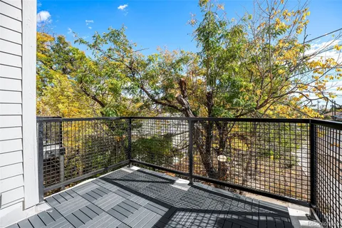 a view of balcony with wooden floor