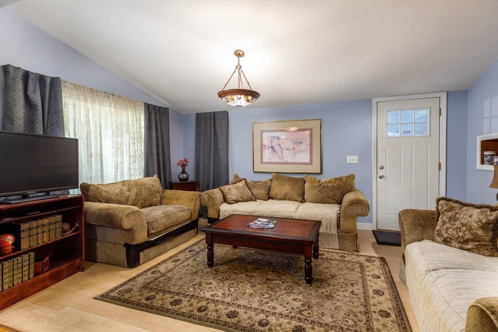 26 Lovell Road Holden, MA 01520 - Photo 5 of 26 a living room with furniture and a flat screen tv