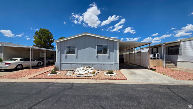 1450 North Dixie Downs Road, Unit 51 St. George, UT 84770 - Photo 2 of 25 Light blue exterior with white trim