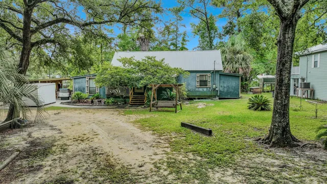 a backyard of a house with lots of green space
