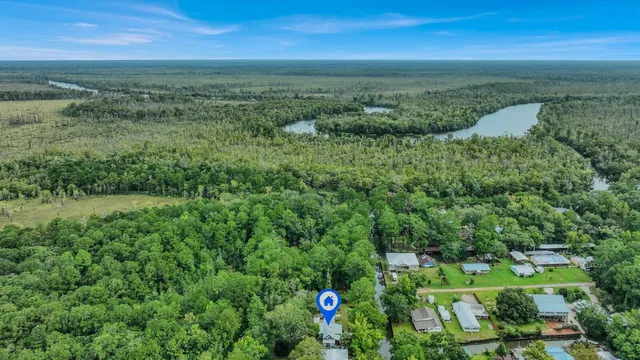 a view of a field with an ocean