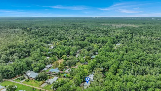 a living room with furniture and a ceiling fan